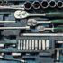 Above view used greasy old dirty car repair mechanic hand tool set kit vehicle repair maintenance